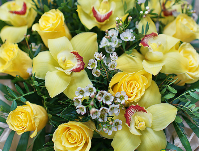 Bouquet with yellow roses and orchids photo